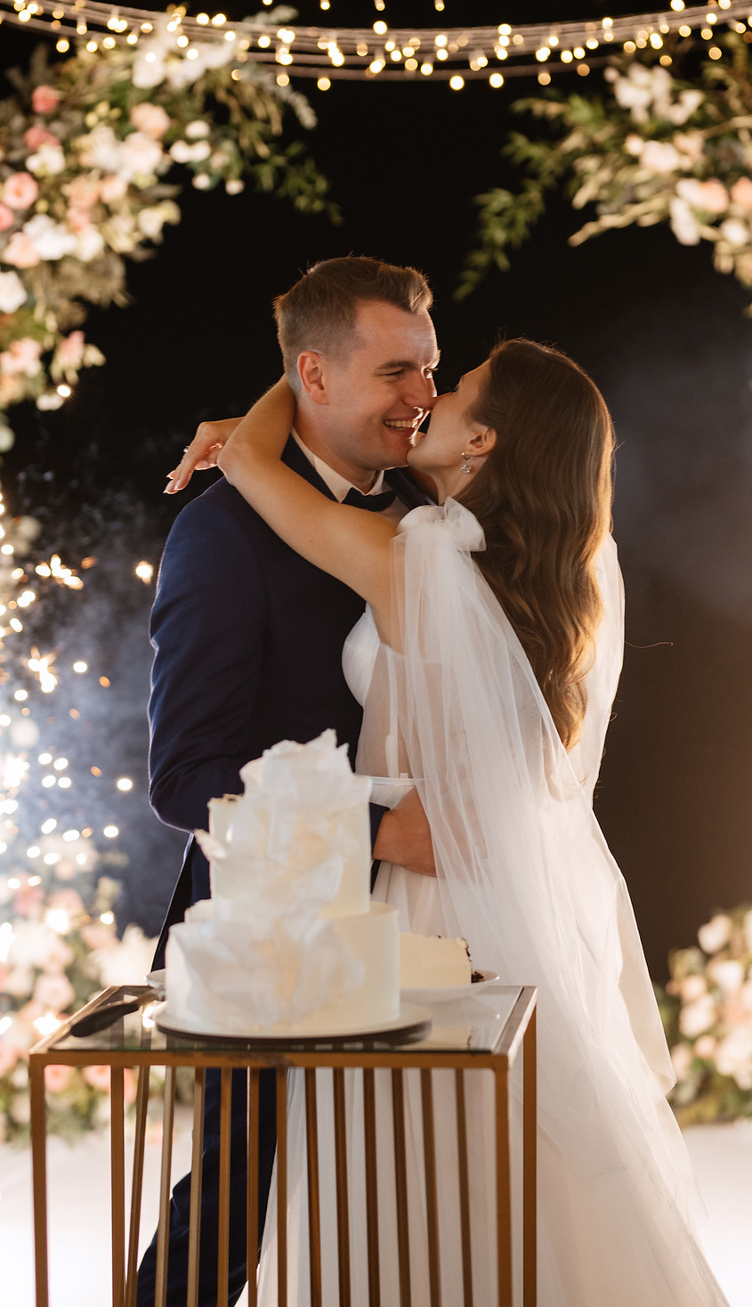 newlyweds-happily-cut-laugh-taste-wedding-cake.jpg