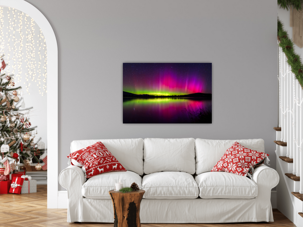 View of the aurora image placed behind a couch.