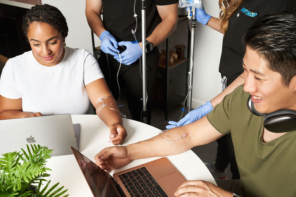Coworkers receiving IV Hydration together