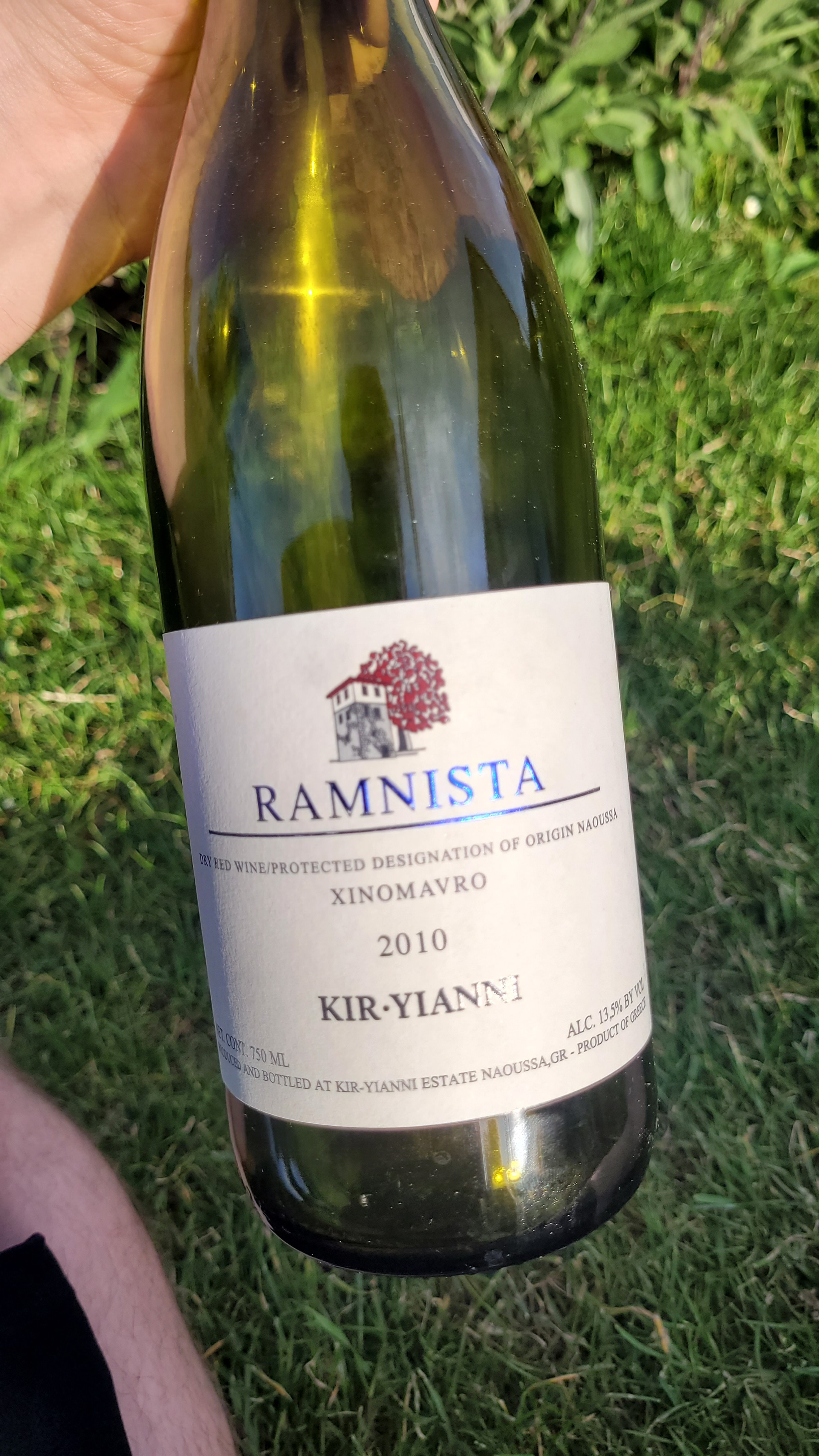 Bottle of Kir-Yianni Ramnista 2010 from Naoussa, lying in grass