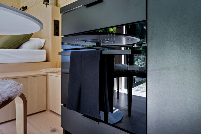 Built-in oven with minimalist controls and integrated microwave function.