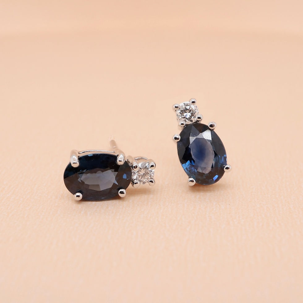 Thumbnail: Oval gemstone and diamond stud earrings in fine gold