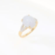 Oval semi-mount ring with diamond cluster shoulders and twist shank in fine gold