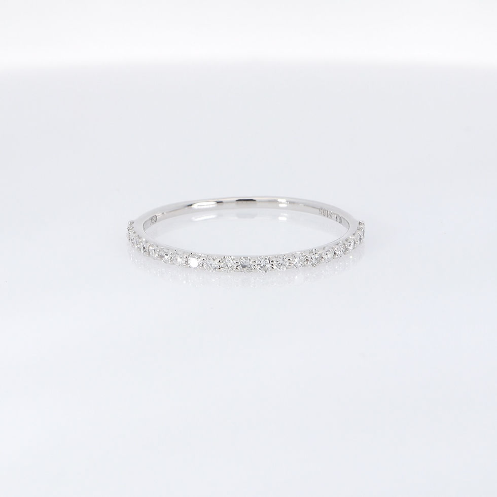 Thumbnail: Delicate pavé diamond ring with a minimalist half eternity design on a thin gold band.