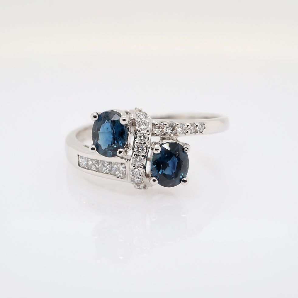 Gemstone jewelry bypass ring with dual blue sapphires and diamonds in gold setting - SVS Jewelry wholesale fine jewelry