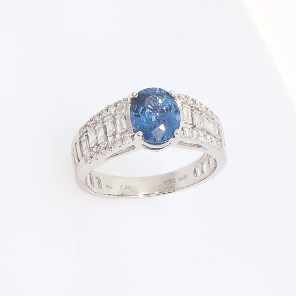 Thumbnail: Wide band engagement ring setting with channel-set baguette and pavé round diamonds in fine gold.