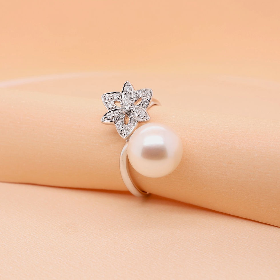 Thumbnail: Pearl and diamond ring with a floral motif in a custom fine gold setting for women.
