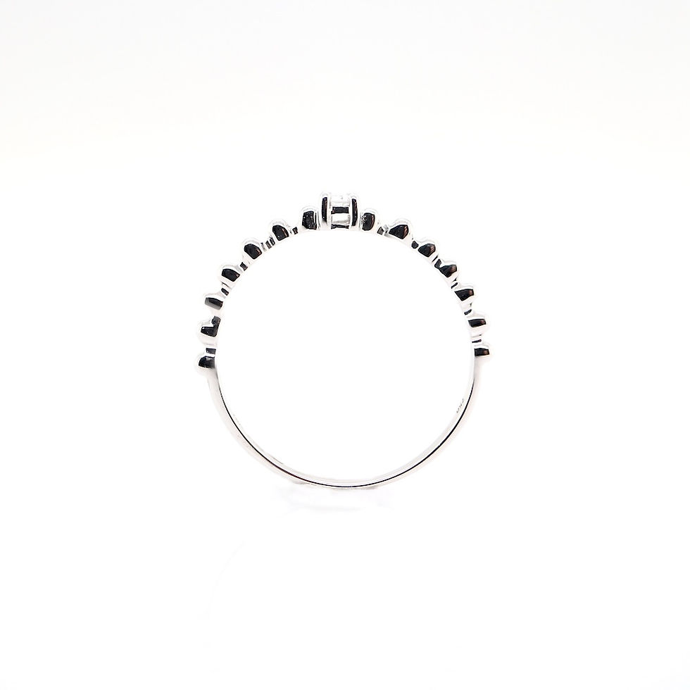 Thumbnail: Dainty diamond ring with a single brilliant stone on a delicate beaded gold stacking band.