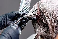 Permanent colour being applied to hair
