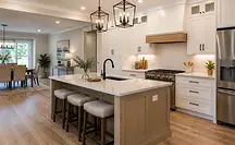 Completed kitchen reconstruction with custom cabinetry, quartz countertops, and hardwood flooring