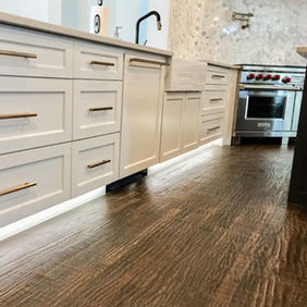 Frisco, TX custom cabinetry with hardware on handscraped hardwood flooring