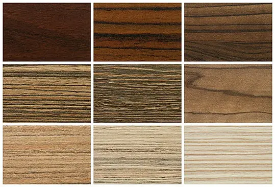 Solid hardwood flooring samples showing various wood grain textures and finishes — from light oak to rich walnut tones