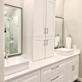 white bathroom vanity with linen tower and 2 porcelain bowl sinks