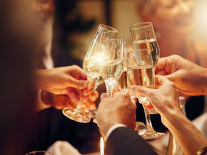 Friends toasting champagne during their holiday vacations