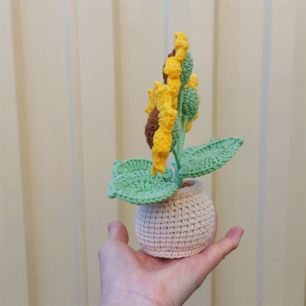 Thumbnail: Handmade crochet sunflower with a small bumblebee on top, crafted from soft yellow and black yarn.