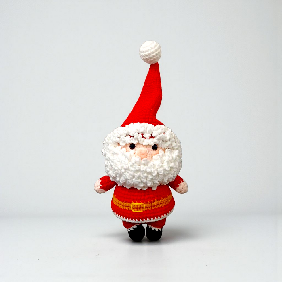 Front view of handmade crochet Santa Claus doll with red suit, fluffy white beard, tall hat and black boots.