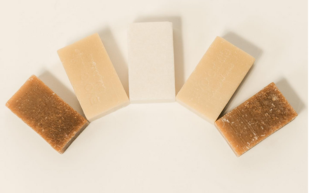 Natural bar soaps arranged in an arch shape.