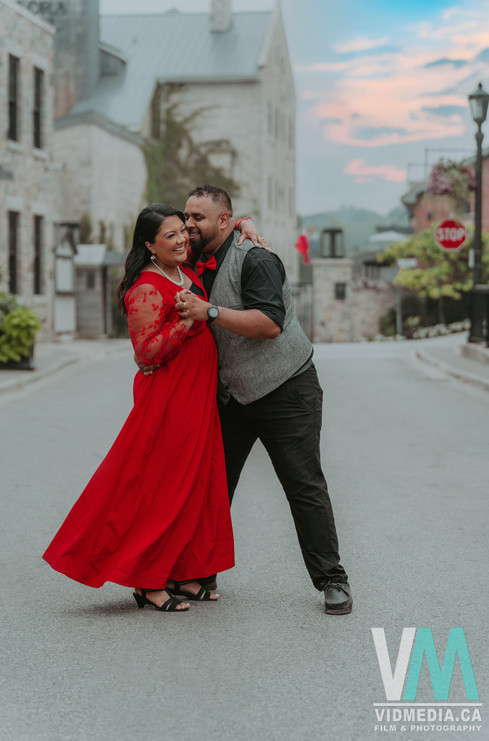 couple doing a dip in front of elora mills wedding venue