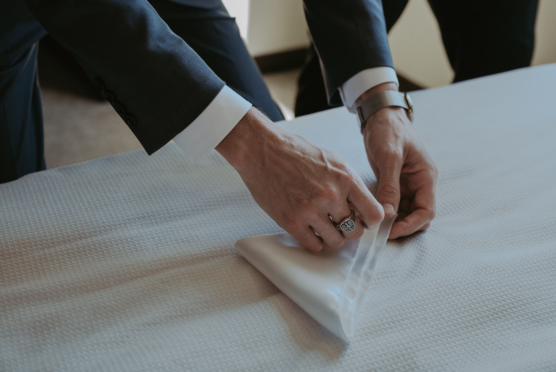 groomsmen putting on tie hotel marriot mississauga