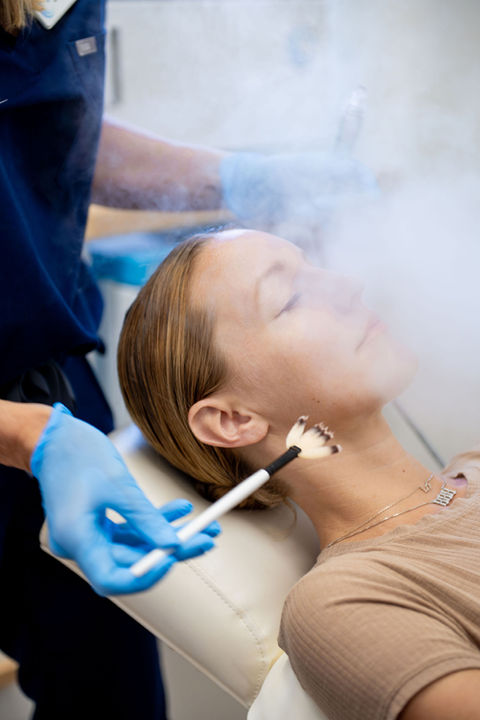A woman receiving Vitaflow Wellness treatment.