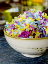 a bowl of colorful sticky rice sitting on a table in Sapa Vietnam.