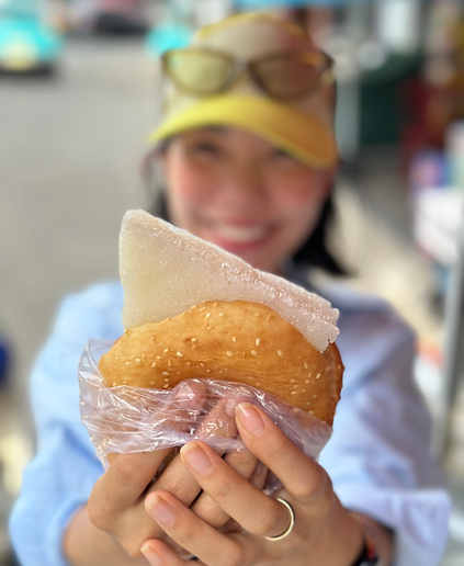 Vietnam's most popula food guide holding a classic southern vietnamese street cake specialty - Banh Bo