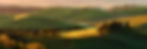Green Hills Under a Golden Sunrise in Val d’Orcia, Tuscany, Italy