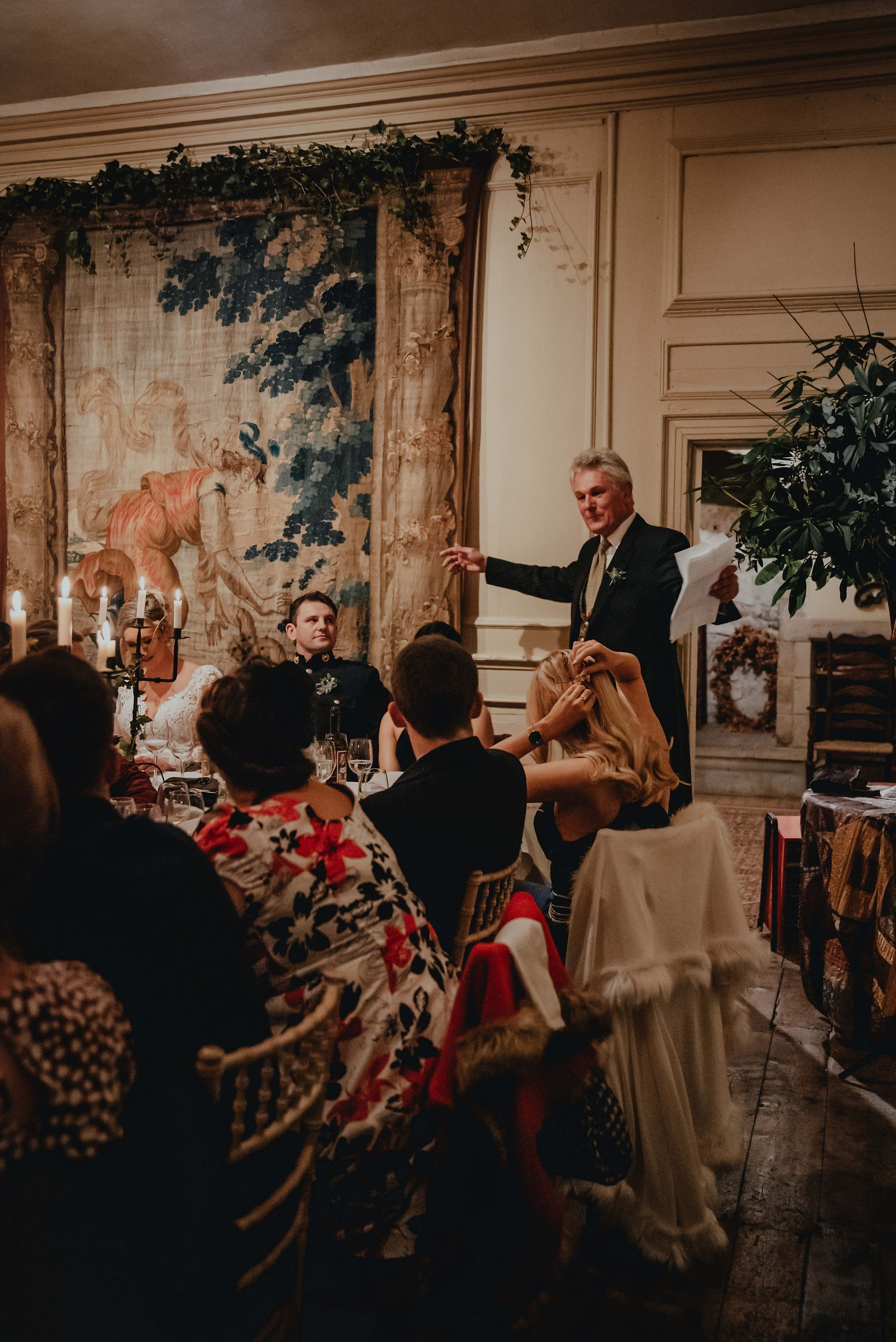 the father of the bride makes a speech at a december weddign at Neidpath Castle