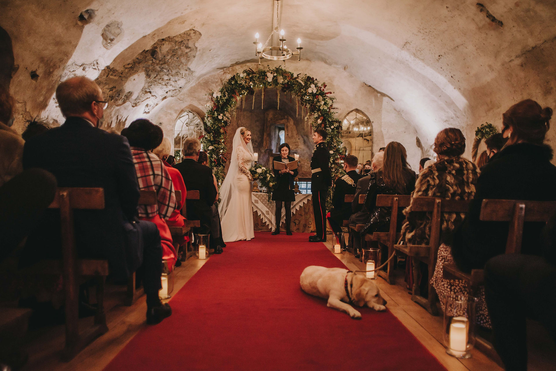 The ceremony room of Neidpath Castle is filled with people and a dog sleeping