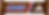 Snickers chocolate bar wrapper with Adidas logo on brown background and blue, red, and white stripes.