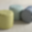 Chartreuse and ivory patterned pouf, weather-resistant artisan cylinder for indoor-outdoor mountain living.
