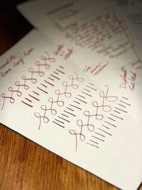 Pink Brown ink writing on white paper reads "Laban Ink Made in Taiwan Aphrodite Pink," with looping patterns underneath. For the Fountain Pen Ink Review. Aphrodite by Laban