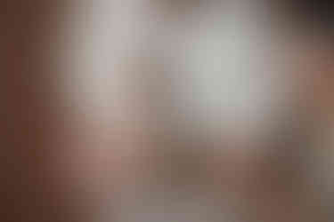 close up of baby girl during family session with mom, dad, and baby taken in Middletown, Ohio at Little Babe Studio