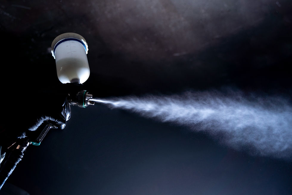 low-angle-worker-spraying-powder-paint-from-gun_edited.jpg