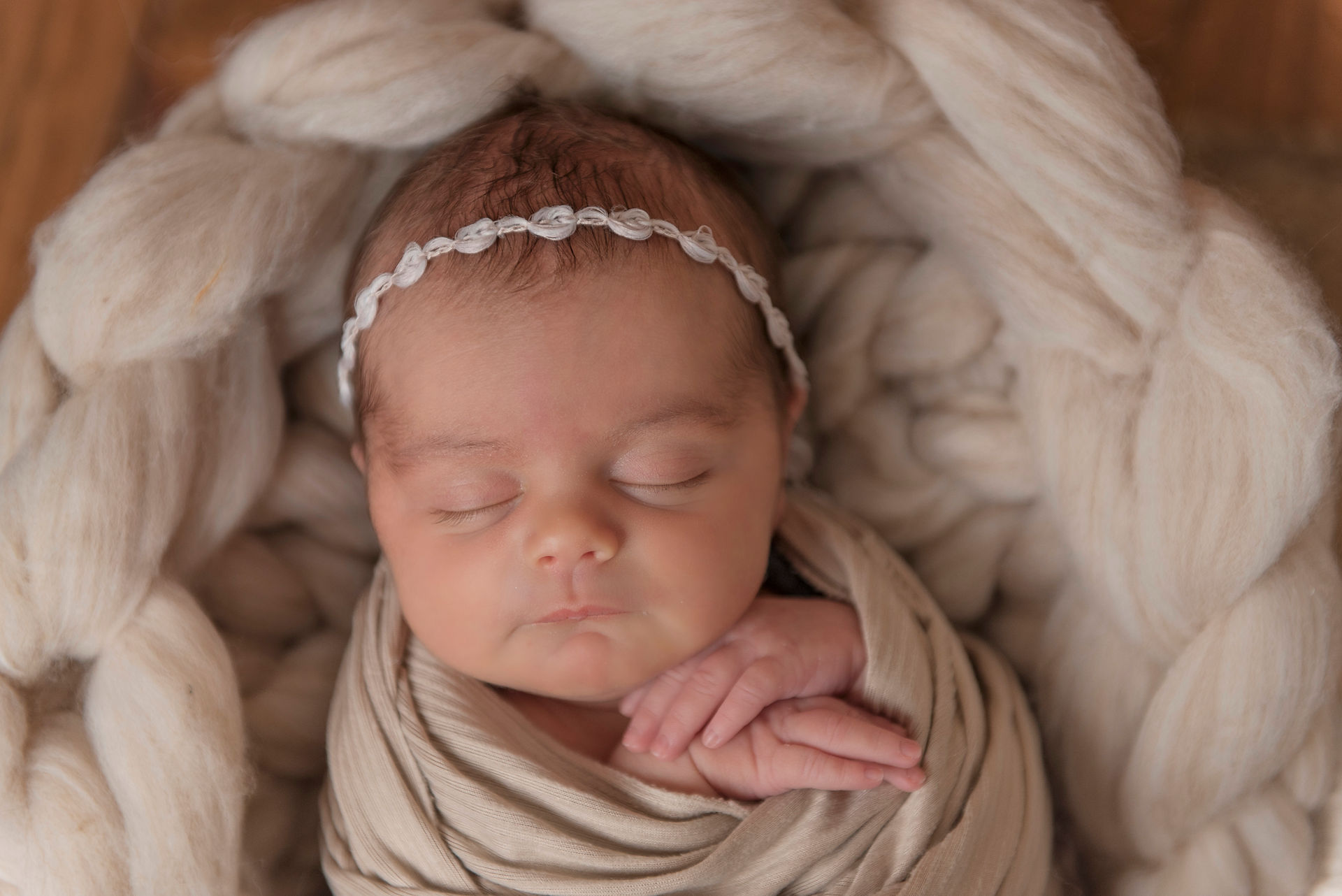 newborn in a green wrap by Easley SC Newborn Photographer