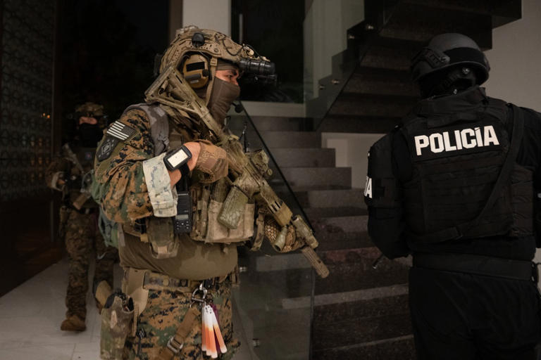 U.S. Military Personnel and Ecuadorian Police in an operation to dismantle a gang in Guayaquil, Ecuador, on Thursday. (© EPA/Shutterstock)