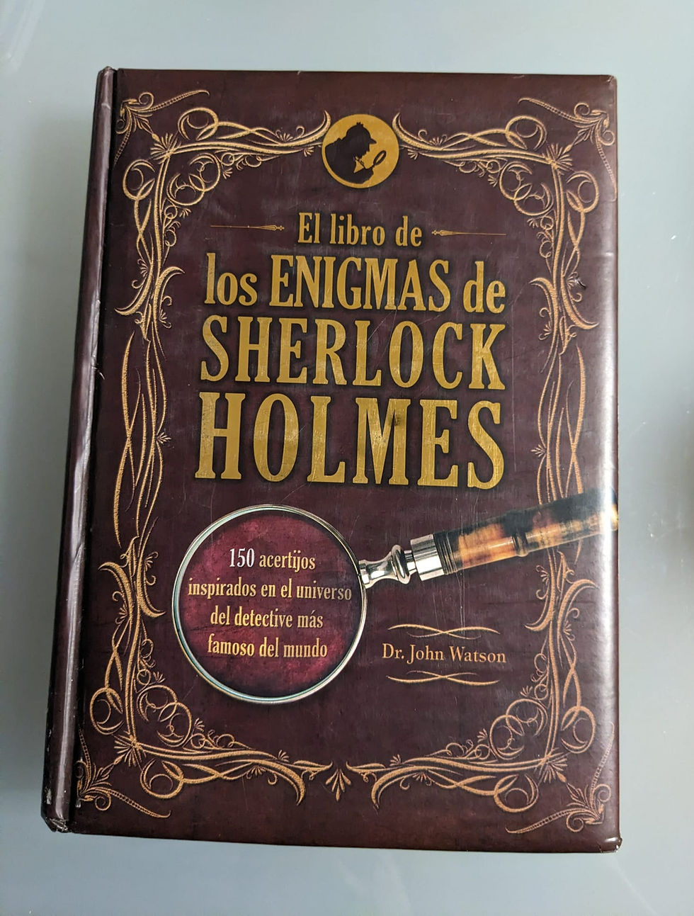 El libro de los enigmas de Sherlock Holmes. Dr. Watson, John. Los libros del abuelo, tu librería solidaria.