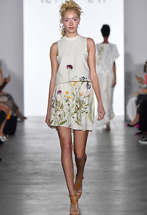 <img src="embroidered skirt.png" alt="embroidered skirt in banana fabric and chlorophyll print in leaves">