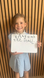 A child’s work from an online phonics session showing neatly written letters and words, progress in blending