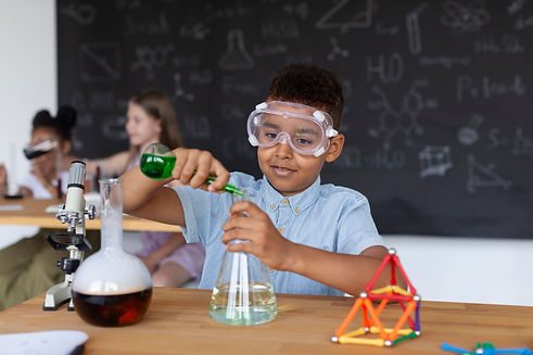young-boy-learning-more-about-chemistry-class.jpg