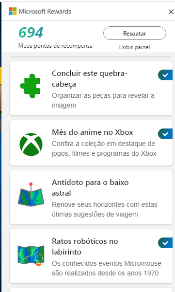 Imagem do Painel Rewards com a quantidade de 694 pontos, um quebra cabeça na cor verde, um símbolo do xbox com a comemoração do seu aniversário, uma imagem de mapa com a legenda de antídoto para o baixo astral e uma imagem de mapa em forma de circuito com a legenda de ratos robóticos no labirinto