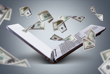 Finance and earning concept, one hundred dollar banknotes flying around laptop, internet,
