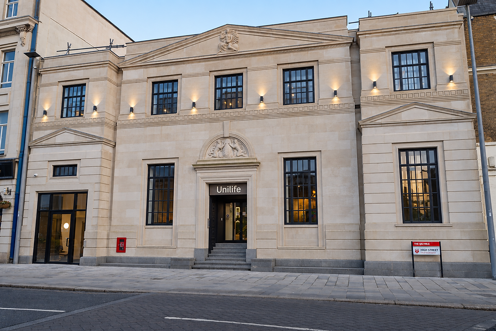 High Street is the transformation of the former Bank of England building in Southampton, into a new student residential development combining the restoration of a locally listed city landmark with contemporary new accommodation.
The project was designed and delivered by Stelling Properties’ in-house architectural team, led by Gary in his role as Head of Technical Architecture and Sustainability, with responsibility extending through detailed technical development and on-site delivery support.
The design begins with the existing building. Its formal Portland stone façade, classical proportions and distinctive architectural details were carefully retained and restored, allowing the historic frontage to remain the principal civic presence on the High Street. Behind it, a new residential building adopts a deliberately different architectural language, creating a clear distinction between retained heritage and contemporary intervention rather than attempting to imitate the original architecture.
The new accommodation is composed as a long, carefully controlled volume fitted within an exceptionally constrained urban site. Light stone-coloured façades reference the tone of the historic building while dark-framed glazing and projecting oriel windows introduce a much more contemporary rhythm. The technical elevations distinguish between smooth stone-effect rainscreen panels and vertically castellated panels, using variation in texture and depth to articulate the larger elevations.
The projecting windows are particularly important to the character of the building. Repeated along the narrow elevations, they generate a strong vertical rhythm and introduce depth, shadow and reflection to façades that are experienced at close quarters within the surrounding urban grain. Internally, the enlarged window zones create usable seating and increase daylight within individual studios while their angled arrangement helps maintain privacy between rooms.
At the junction between old and new, the project required careful architectural and technical coordination. Existing floor levels, basement structures and retained fabric are brought together with the new residential accommodation, circulation cores and building services. The new multi-storey accommodation extending immediately behind the retained building, with the historic front rooms adapted to provide entrance, reception and generous communal spaces.
The retained building becomes the social heart of the development. Its larger rooms and existing proportions are used to provide reception, lounges, games areas and study space, while further communal facilities include a gym, kitchen, cinema and landscaped roof terrace. Double-height areas and the contrast between the more formal historic rooms and contemporary interior interventions give the shared spaces a distinct character.
This approach allows the project to retain more than simply a façade. The existing bank building and its basement vaults were incorporated into a new pattern of use, bringing a building that had remained derelict for more than a decade back into active occupation.
The environmental performance was developed alongside the architectural strategy. The completed scheme incorporates mechanical ventilation with heat recovery, rooftop photovoltaic generation and an energy-efficient building envelope, while the reuse of the existing building retains valuable fabric and gives a redundant city-centre asset a new long-term purpose. This integrated approach to sustainability was recognised at the South Coast Property Awards 2025, where High street was named Sustainable Development of the Year, reflecting the project’s combination of heritage reuse, environmental performance and contemporary design.
Bargate House demonstrates how heritage, contemporary architecture and environmental performance can work together as part of a single regeneration strategy, preserving the identity of an important Southampton building while adapting it for a new generation of occupation.
