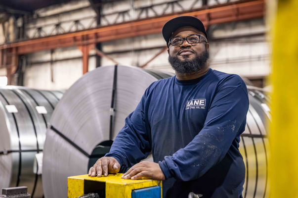 Manufacturing employee portrait inside a steel mill