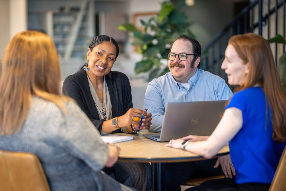 Business professionals collaborating in conference room