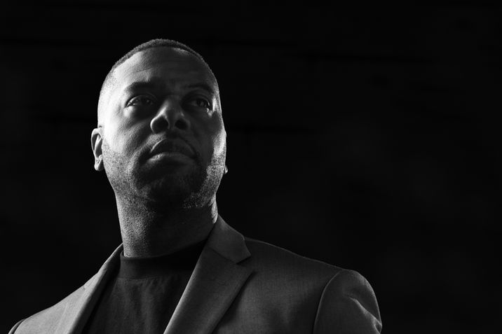 Dramatic executive portrait with studio lighting