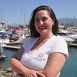 A woman standing at the Marina Puerto Vallarta