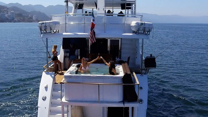 A superyacht with a jacuzzi and american flag