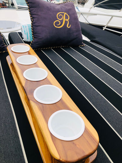 Cup holders and a pillow with the letter R