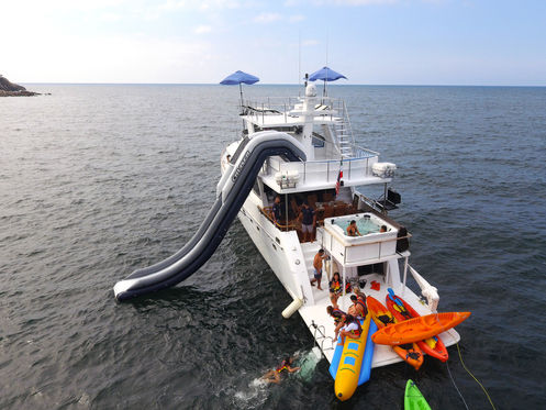 A yacht with a waterslide